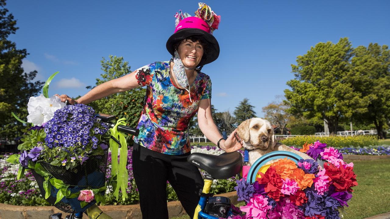 Kathleen Flanagan and Teddy, in Laurel Bank Park, on the way to join the Toowoomba For Climate Action entry in the floral parade of the Carnival of Flowers. Picture: Kevin Farmer