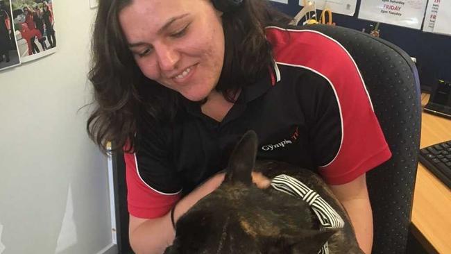 Josie Laird has a cuddle with Louis at The Gympie Times office to get ready for Bring Your Pet to Work Day. . Picture: Frances Klein