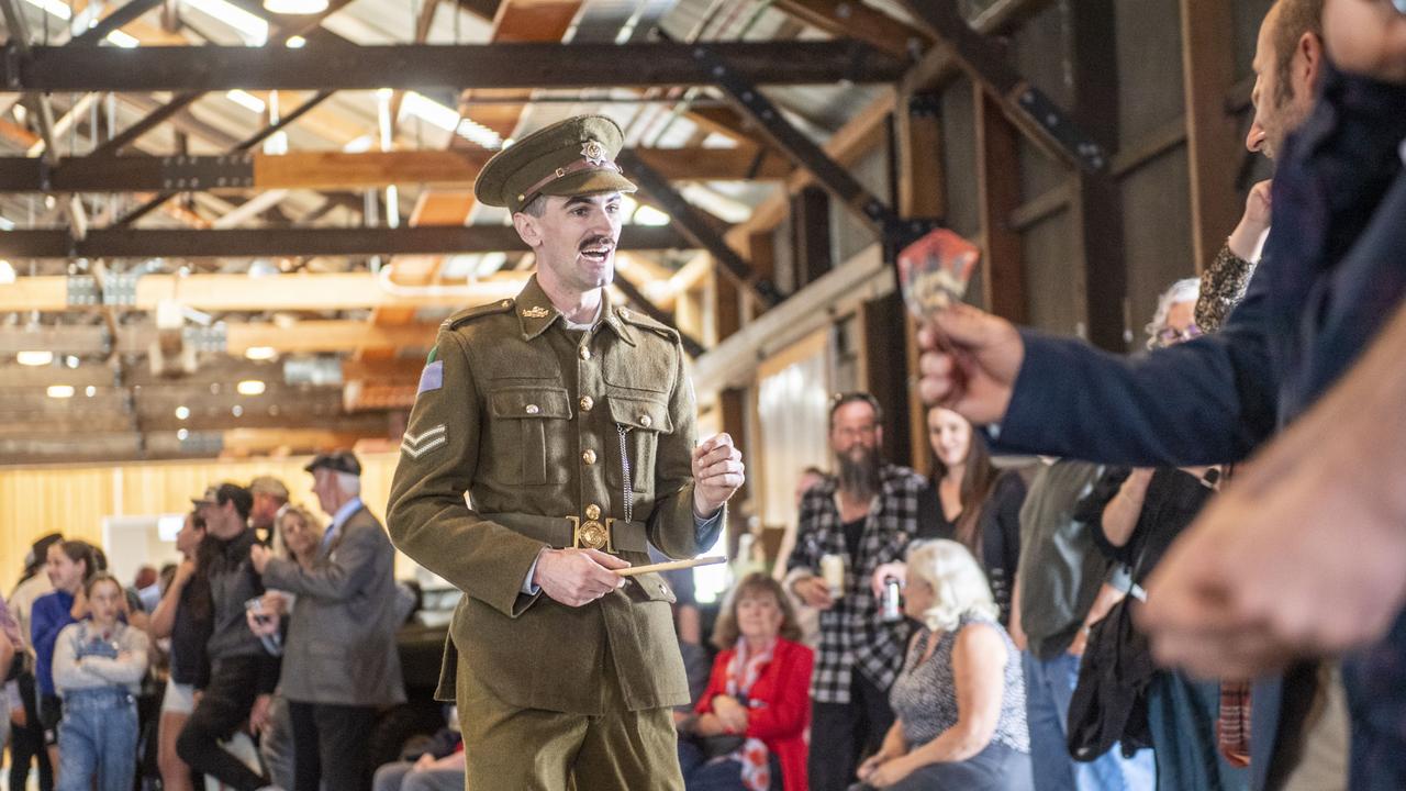 Spencer Smith relishes his chance at being the Spinner in a Two-up game on ANZAC Day in The Goods Shed. Tuesday, April 25, 2023. Picture: Nev Madsen.