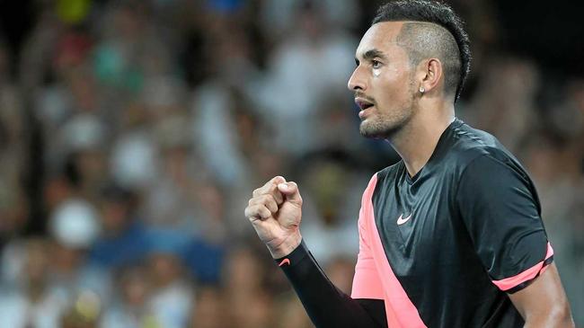 Nick Kyrgios celebrates his win against Viktor Troicki. Picture: JULIAN SMITH