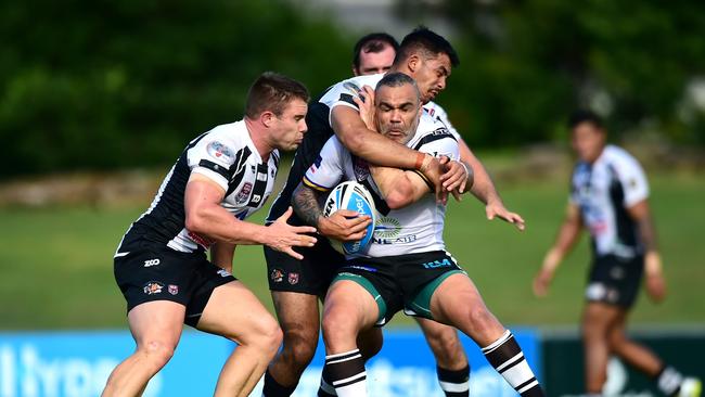 Phil Dennis is wrapped up by the Tweed Heads defence. PHOTO: SCOTT DAVIS - SMP IMAGES