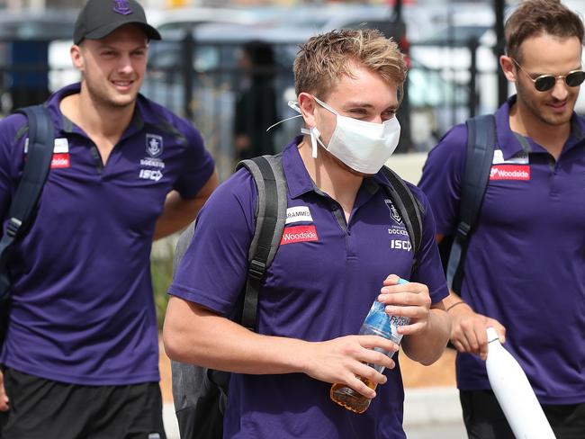 PERTH, AUSTRALIA - MARCH 19: Mitchell Crowden of the Dockers  arrives with team mates at Perth airport prior to their flight to Melbourne for their opening game of the 2020 Season, at Perth Airport on March 19, 2020 in Perth, Australia. (Photo by Paul Kane/Getty Images)
