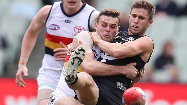 IN DEMAND: Crow Brad Crouch tackles Carlton’s Marc Murphy during last week’s loss at the MCG. Picture: MICHAEL KLEIN.