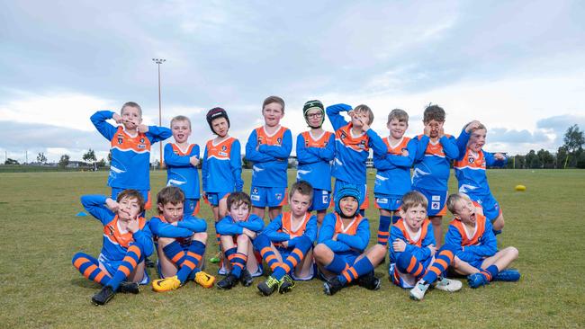 Armstrong Creek Copper Skarks under-9 football team pull their funniest faces.