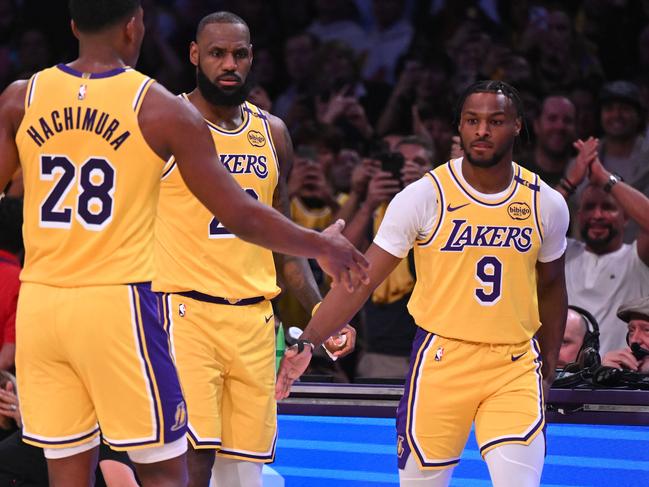LeBron and Bronny James take to the court in their first game playing together as Lakers. Picture: Getty Images