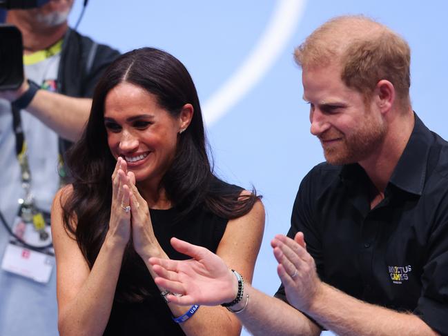 Meghan Markle and Prince Harry at the mixed team wheelchair basketball medal ceremony during day four of the Invictus Games. Picture: Getty Images