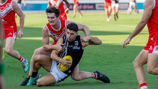 Waratah’s Scott Carlin tackles Connor Wright in the 2024-25 NTFL men's Round 2 match between Palmerston and Waratah. Picture: Pema Tamang Pakhrin