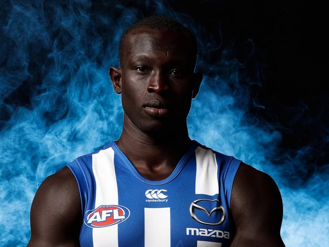 MELBOURNE, AUSTRALIA - MARCH 1: Majak Daw of the Kangaroos poses for a photograph during the North Melbourne Kangaroos 2018 official team photo day at Arden Street on March 1, 2018 in Melbourne, Australia. (Photo by Michael Willson/AFL Media)