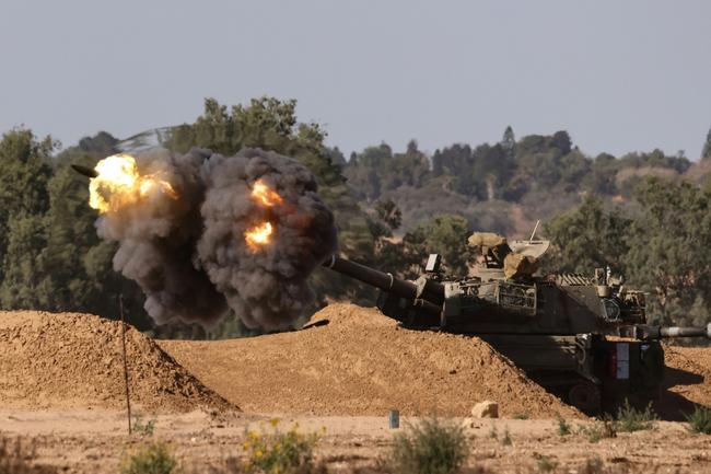 An Israeli mobile artillery unit fires toward Gaza from southern Israel -- US President Joe Biden threatened to halt supplies of artillery shells if Israel carries out a full-scale invasion of Rafah