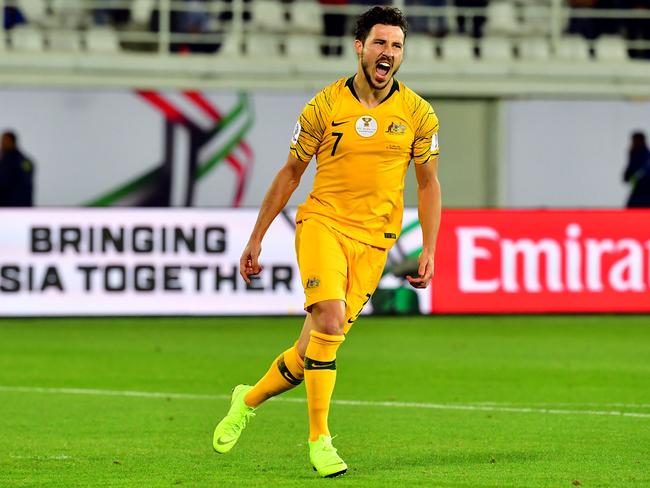 Mat Leckie celebrates scoring a penalty for Australia during the 2019 AFC Asian Cup against Uzbekistan. Picture: Giuseppe CACACE / AFP