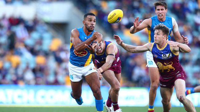 Touk Miller, with David Swallow in the background, is the newest Gold Coast co-captain. Picture: Getty Images