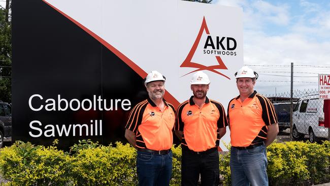 AKD Softwoods chief executive Shane Vicary (centre) with staff in Caboolture, Queensland.