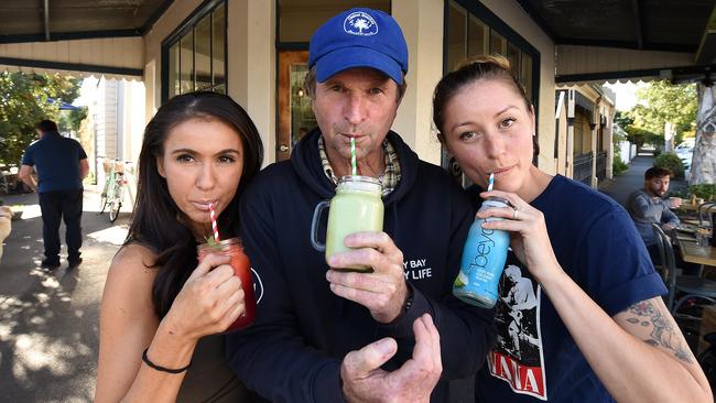 Station Street Trading Co’s Andrea Andrews, and Layla Beavis, right, with Beach Patrol Australia vice president, Ross Headifen. Picture: DAVID SMITH