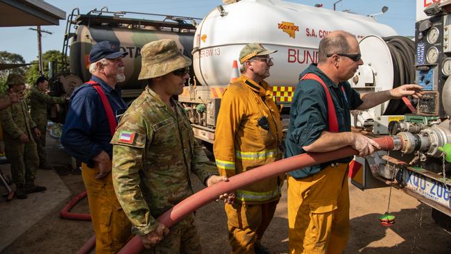 Army Reservist Arthur Hall helps both MFS and CFS with water fills at Parndana CFS station. Picture: Brad Fleet