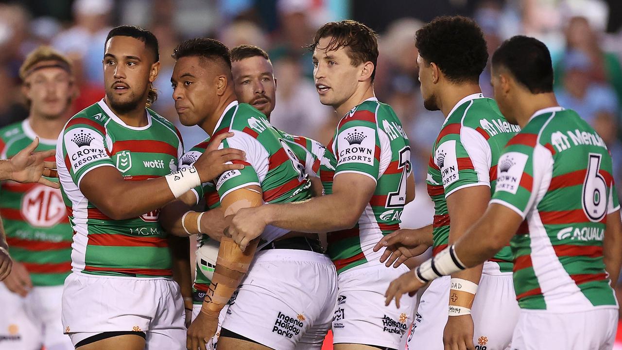 Tevita Tatola supported by teammates after a head knock. Picture: Getty