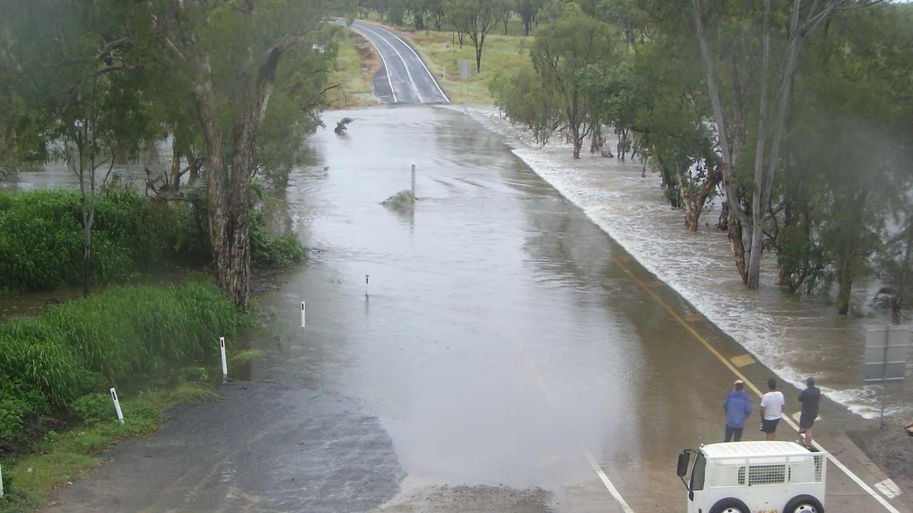 Flooding over the Mulligan Highway this morning at the McLeod River cross. Police have praised the motorists for heeding the "if it's flooded, forget it" message. Picture: TMR