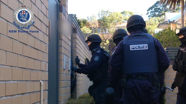 Police enter the property on Saturday to arrest the couple.