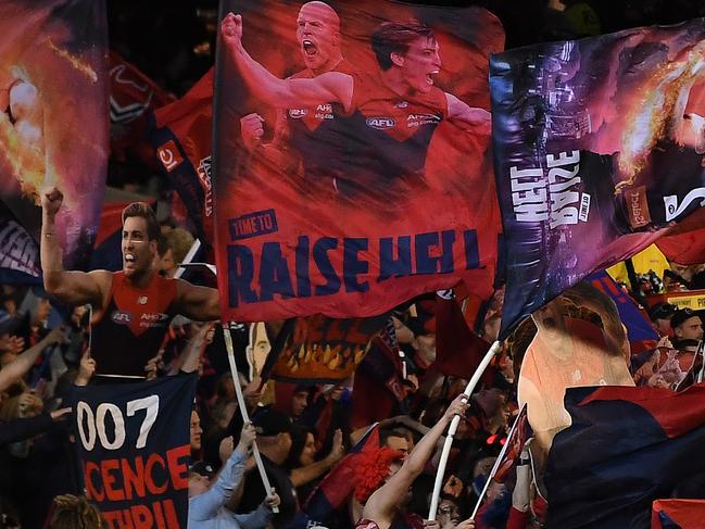 Fans of the Demons are seen during the First Semi Final between the Hawthorn Hawks and the Melbourne Demons in Week 2 of the AFL Finals Series at the MCG in Melbourne, Friday, September 14, 2018. (AAP Image/Julian Smith) NO ARCHIVING, EDITORIAL USE ONLY