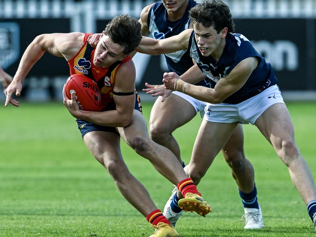 Cumming (L) shrugs a tackle. Picture: Getty Images