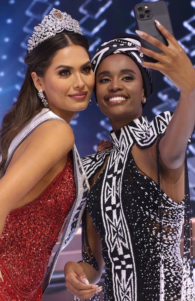 Miss Universe 2021 Andrea Mesa and Miss Universe 2019 Zozibini Tunzi take a selfie onstage. Picture: Getty