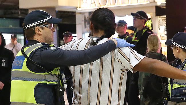 Police keep an eye out for possible trouble between rival youth gangs near Flinders Street Station. Picture: Ian Currie