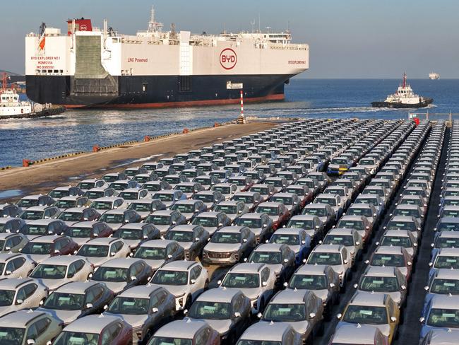 (FILES) This file photo taken on January 10, 2024 shows electric cars for export waiting to be loaded on the "BYD Explorer NO.1", a domestically manufactured vessel intended to export Chinese automobiles, at Yantai port, in eastern China's Shandong province. China overtook Japan as the world's biggest vehicle exporter last year, data from the Japan Automobile Manufacturers Association (JAMA) showed on January 31, 2024. (Photo by AFP) / China OUT