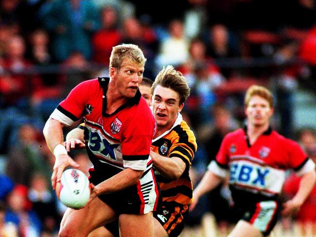 Gary Larson (ball) looks for support during North Sydney Bears v Balmain Tigers NRL game at North Sydney Oval in 1999.