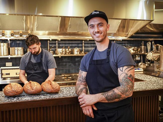 Chef Blake Drinkwater (back) with chef/owner Nathan Sasi at Leigh Street Wine Room. Photo: AAP/Mike Burton