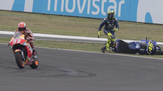 Valentino Rossi goes to pick up his bike after his contact with Marc Marquez in the Grand Prix of Argentina.