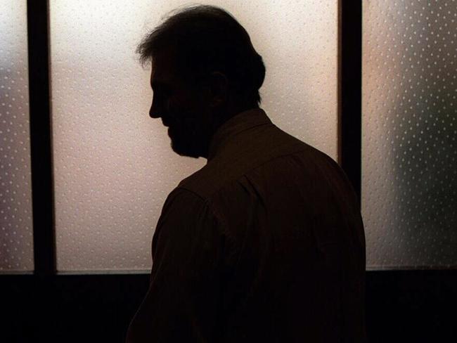 Generic image. Silhouette of a man (parent of) a sex abuse victim in an office. wrongly accused of touching young girl. Child sexual abuse. sex crime incest paedophilia.