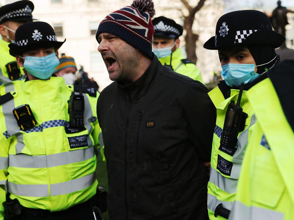 An anti-lockdown protester is arrested by police officers in Parliament Square in central London as MPs voted retrospectively on England’s national lockdown Picture: Dan Kitwood/Getty Images