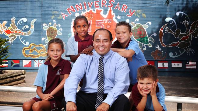 David Galea who is the principal of Doonside Public School in Sydney's west with students Talara, 10, Jenelle, 7, Kayleb, 8 and Braedyn, 6, with has an attendance rate of over 90 percent and improved NAPLAN results. Most of the school’s students are from non-English-speaking and indigenous backgrounds. (Pic: John Feder/The Australian)