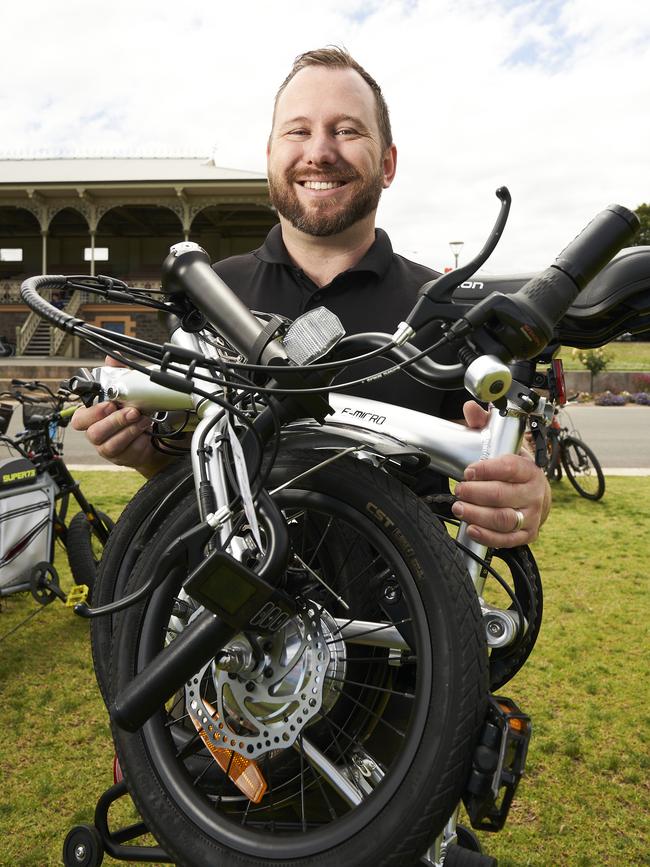 Scott Pearce with a folding electric bicycle at Victoria Park. Picture: Matt Loxton