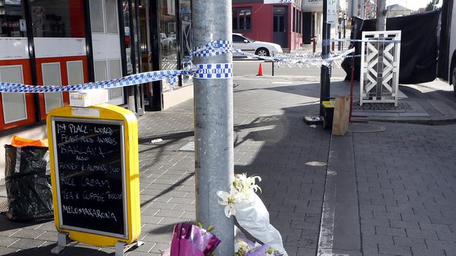 Tributes for Voula Delios outside her shop. Picture: KIM EISZELE