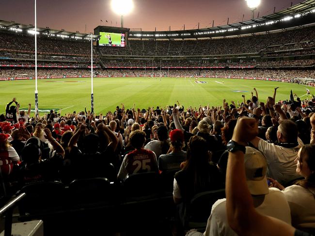 Collingwood fans celebrate a goal with a big crowd during the Round 1 AFL match between the Collingwood Magpies and the Sydney Swans at the MCG on March 15, 2024. Photo by Phil Hillyard(Image Supplied for Editorial Use only - Phil Hillyard  **NO ON SALES** - Â©Phil Hillyard )