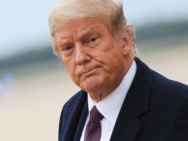 (FILES) In this file photo US President Donald Trump gives a thumbs up as he steps off Air Force One upon arrival at Andrews Air Force Base in Maryland on October 1, 2020. - Doctors will decide on October 5, 2020 whether President Donald Trump can be discharged from hospital following emergency treatment for the coronavirus, a top White House official said. Chief of Staff Mark Meadows told Fox News that the "determination has not been made yet" but "doctors will make a decision on whether to discharge him later today." (Photo by MANDEL NGAN / AFP)