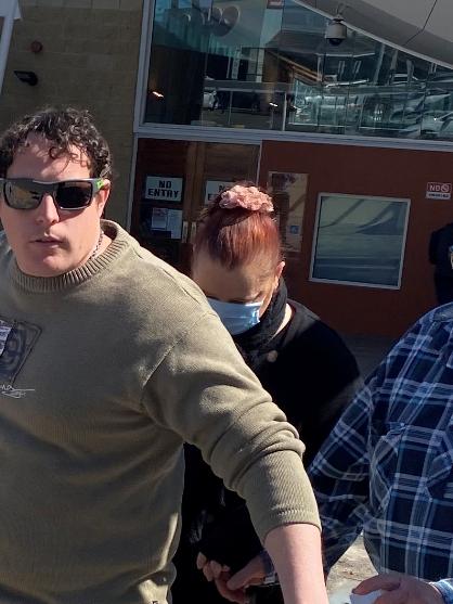 Flanked by supporters, Kylee Pryor (pictured in mask) leaves Toronto Local Court on Monday convicted of defrauding a Lake Macquarie business more than $200,000. Picture Amy Ziniak