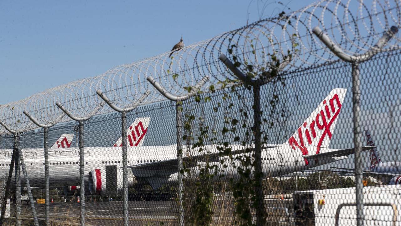 Grounded Virgin aircraft parked at Brisbane Airport. Picture: Jono Searle/Getty Images