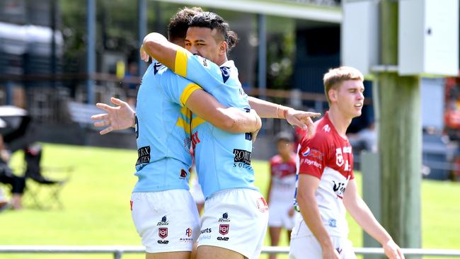 Norths Devils players celebrate a try. Picture, John Gass