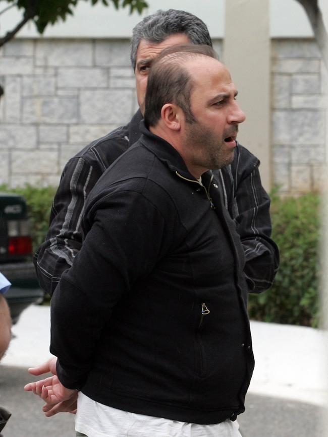 Gotcha: Mokbel being moved to an Athens jail in preparation for his extradition to Australia. Picture: Tim Anderson