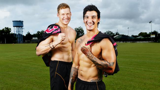 Nightcliff football players Sebastian Guilhaus and Blake Miles with warm up tshirts that will be auctioned with a donation of proceeds going towards the NT Breast Cancer Voice.