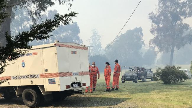 Fire and SES monitor an out of control bushfire at the top of Medeas Cove Road, St Helens.