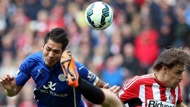 Leicester City's Leonardo Ulloa, left, vies for the ball with Sunderland's Seb Coates, right, during their English Premier League soccer match between Sunderland and Leicester City at the Stadium of Light, Sunderland, England, Saturday, May 16, 2015. (AP Photo/Scott Heppell)