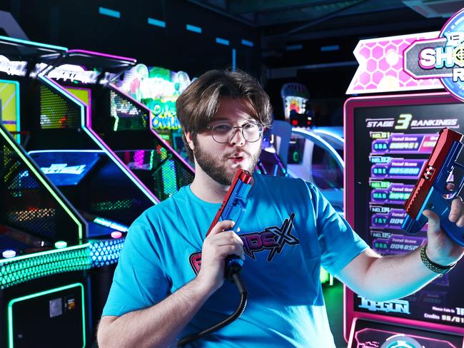 The Cairns northern beaches now has its very own video game arcade, after ArcadeX opened on Mount Millman Drive at Smithfield. ArcadeX assistant manager Kydan Sheppard plays Shooting Range, a next generation shooting game. Picture: Brendan Radke