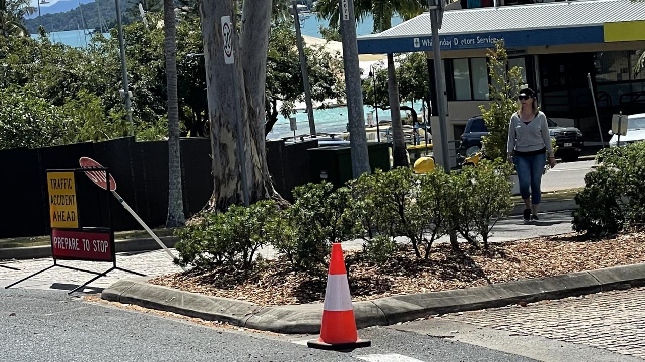 Access to the main strip at Airlie Beach closed as emergency services remain at the scene where a man in his 30s was shot by police overnight.