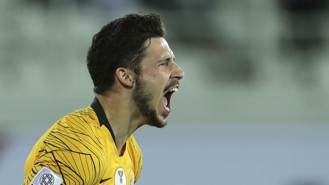 Socceroos forward Mathew Leckie celebrates after scoring the winning penalty. Picture: AP