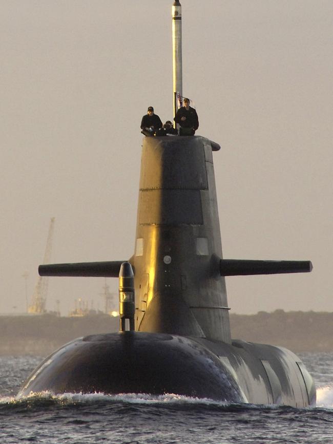 HMAS Collins at sea during sunrise. Picture: Damian Pawlenko