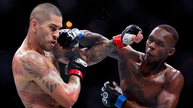 Israel Adesanya punches Alex Pereira on his way to victory.. Carmen Mandato/Getty Images/AFP