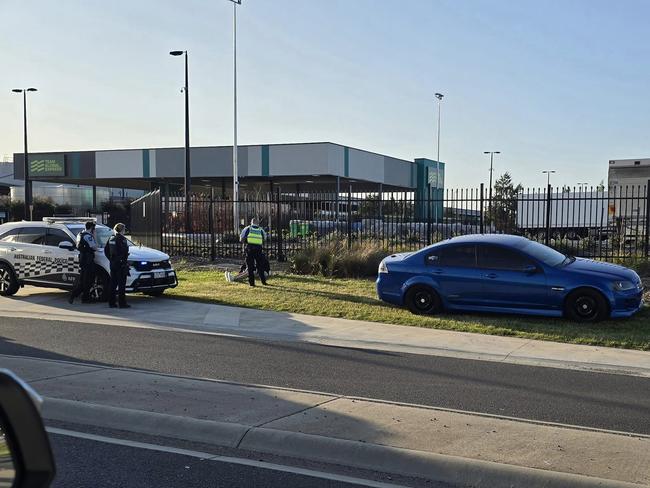 Federal Police arrest a man in the northern suburb. Picture: Facebook