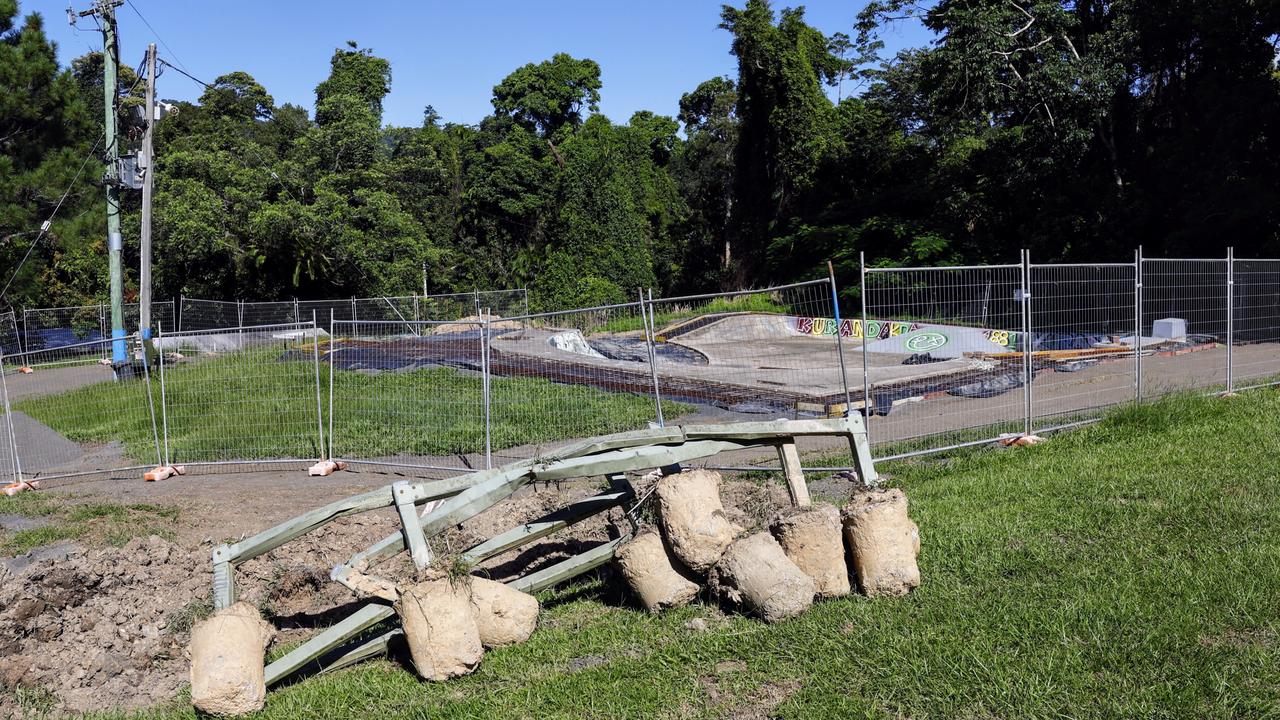 Mark Riley is annoyed that the unusable Kuranda skate park has been closed for years, and now has old infrastructure dumped beside it, with grass unable to be cut. Picture: Brendan Radke